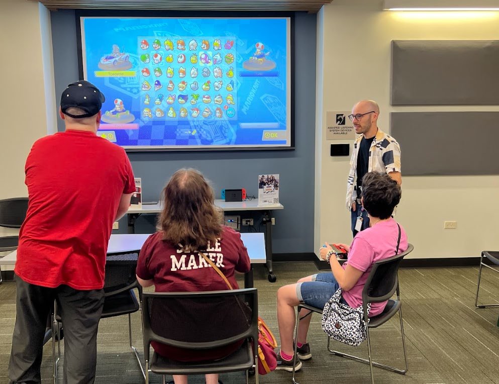 Participants playing together at Deerfield Public Library’s adaptive arcade.