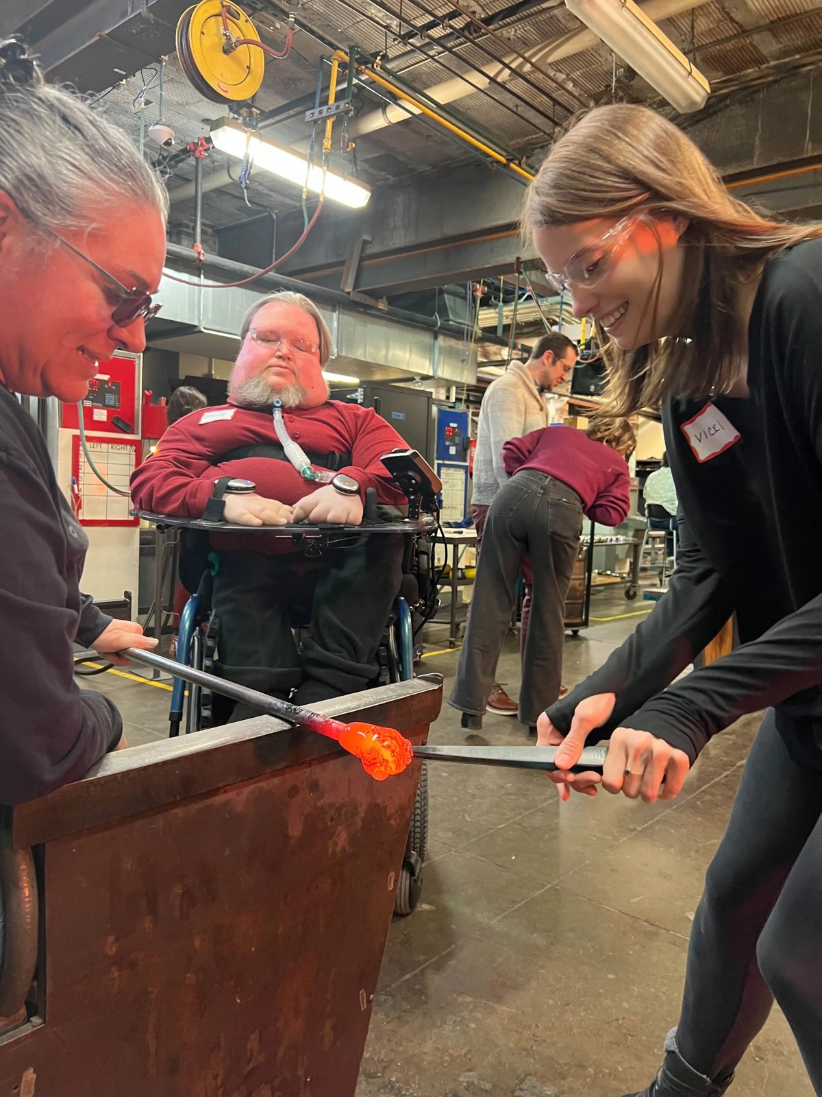 Vicki and Steve taking part in a glass-making workshop.